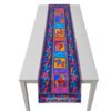Tischläufer mit bunten Pferden von Laurel Burch. Stoff-Unikate handmade in Germany