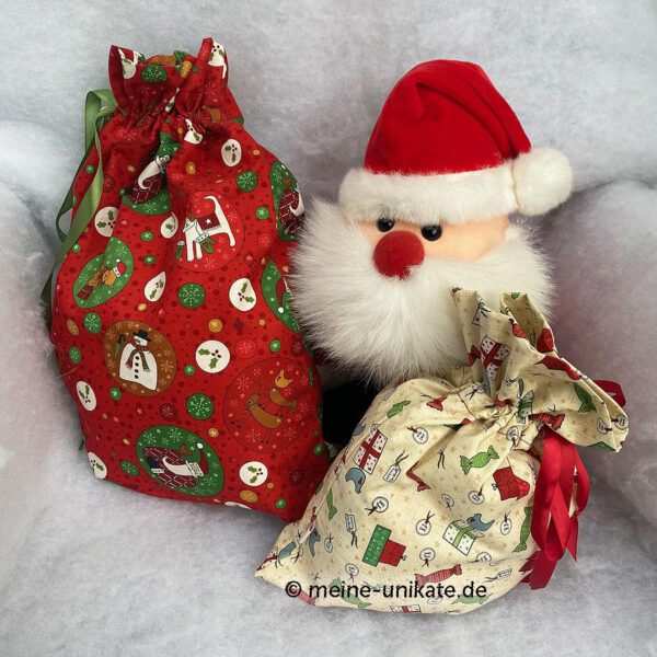 2er Set Geschenksäcke, Stoffbeutel, Verpackung zu Weihnachten. Genäht aus Baumwollstoffen in rot und creme mit Weihnachtsmotiven. Stoff-Unikat handmade in Germany