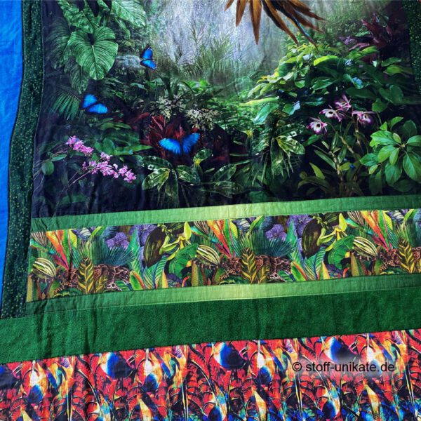 Detailansicht vom unteren Rand der Quiltdecke, Tagesdecke mit Regenwaldtieren. Stoff-Unikat handmade in Germany