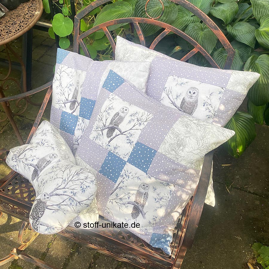 Gruppenfoto aus der Deko-Kissen-Serie Schnee-Eulen. Stoff-unikate handmade in Germany