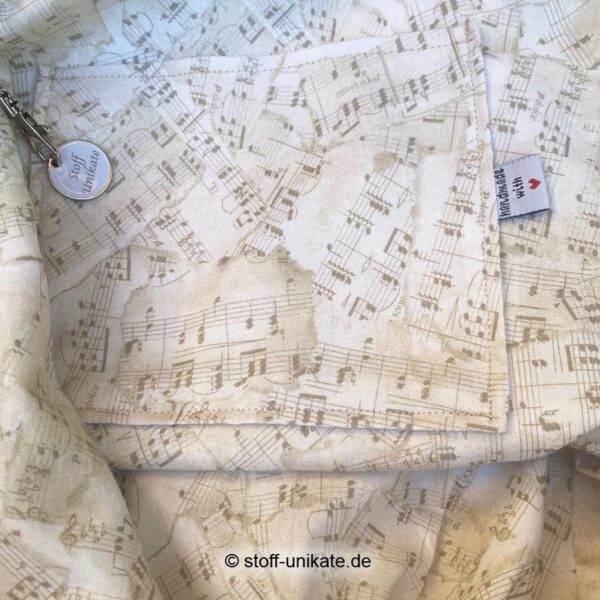 Innentasche vom Jumbo-Shopper mit Musikinstrumenten in Beigetönen. Stoff-Unikate handmade in Germany