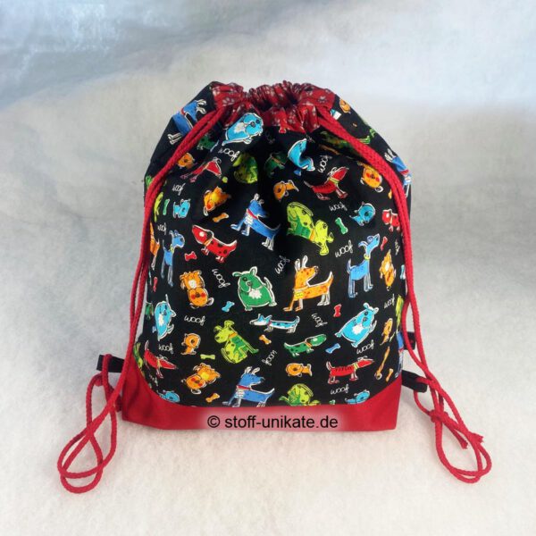 Kinderturnbeutel mit bunten Hunden auf Schwarz. Stoff-Unikate handmade in Germany