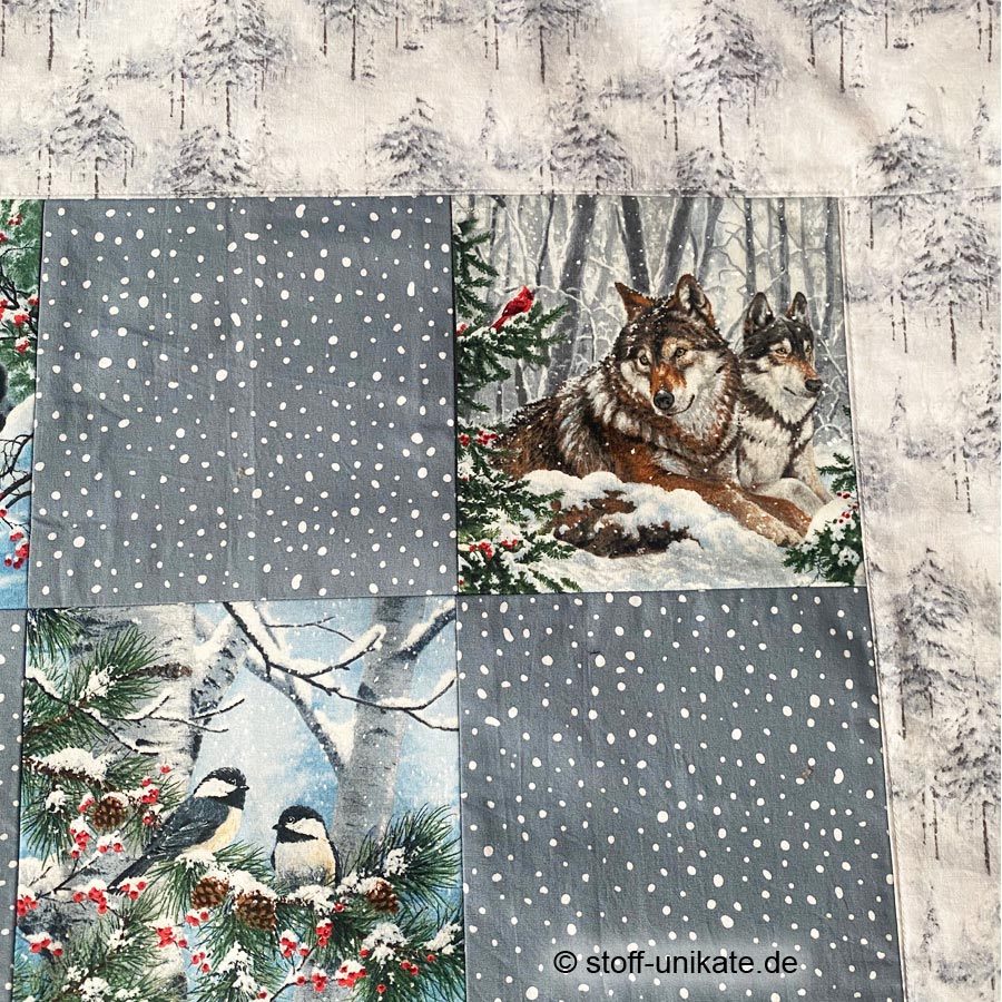 Detailansicht von Wölfen und Vögeln von der tischdecke Wintertiere. Stoff-Unikate handmade in germany